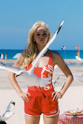 model ayla wearing coca cola and something very specail with seagul in foreground