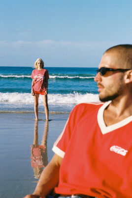 model ayla & bruno wearing coke x svs shirt at beach